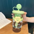 Detailed view of the cute flower-adorned fruit tea cup with a built-in tea infuser - 500ml / Green
