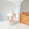 Kreativer Tritan-Milchflaschenbecher mit Griff und Teesieb für Kinder aus Kunststoff - 380ml / SLB6118 Kunststoffbecher-Lächeln ohne Blinzeln