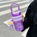 Portable purple water bottle with large handle and flower charm for outdoor use. - 450ml / Purple