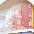 Cute round glass water bottle featuring pink lid, straw topper, and cartoon bear design - 1100ML / Pink