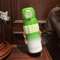 Detailed view of a green gradient 316 stainless steel thermos bottle with textured grip - 580ml / Green