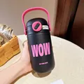 Close-up of black stainless steel insulated water bottle with pink handle and WOW text - 500ml / Black