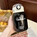 Detail view of black stainless steel insulated cup with 'Live For Yourself' engraving - 500ml / Black (White Contrast Design)