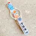 Detail showing cute floral pattern and silicone ring on portable water bottle strap - Happy Today