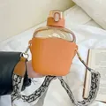Minimalist Nordic style orange plastic water bottle with straw, silicone sleeve and shoulder strap - 700ml / Orange