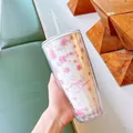 Detailed view of sakura pattern on double-walled plastic straw cup with text - 750ml / White