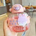 Close-up of a cute pink rabbit-themed children's straw water bottle held by hand - 850ml / Pink (s-2009)