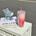 Pink gradient double-layer plastic straw cup with star patterns in lifestyle setting - 750ml / Red