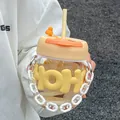 Close-up detail of a cute yellow glass straw cup with HOH sleeve and portable white chain - 400ml / Hand Chain Handle Style / Yellow