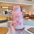 Primer plano de una bonita botella térmica rosa para niños con una funda de silicona de conejo - 520ml / Estilo de Conejo de Dibujos Animados (H-228) / Rosa