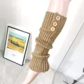 Detailed view of khaki cable-knit leg warmers featuring three decorative wooden buttons - One Size / Solid Camel