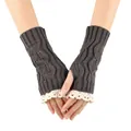 Detailed close-up of grey knit fingerless gloves with hollow leaf pattern and white lace trim. - One Size / Dark Gray