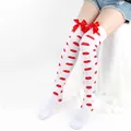 Detail of white over-the-knee socks featuring red lip prints and satin ribbon bows. - One Size / White Socks With Red Lip Print And Red Bow