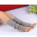 Close-up view of grey ribbed knit leg warmers featuring three decorative buttons. - One Size / Light Gray