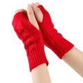 Detailed view of bright red knitted fingerless gloves with soft textured pattern - One Size / Red
