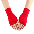 Detailed view of red knitted fingerless gloves with hollow heart crochet pattern - One Size / Red