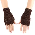 Detail shot of brown knitted fingerless gloves featuring an intricate heart hollow pattern - One Size / Coffee