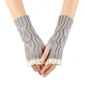 Close-up of grey knitted fingerless gloves with delicate white lace trim and leaf pattern. - One Size / Light Gray