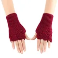 Detailed view of dark red knitted fingerless gloves with heart-shaped hollow-out patterns - One Size / Burgundy