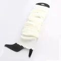 Detailed macro view of white knitted leg warmers displayed on a black leg board - One Size / White