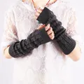 Close-up of dark grey cable knit fingerless arm warmers showing thick warm texture - Dark Gray