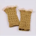 Close-up of mustard yellow cable-knit leg warmers with delicate lace trim detail - One Size / Camel