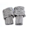 Pair of short grey knitted boot cuffs with elegant openwork pattern and ribbed design - One Size / Light Gray