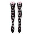 Detailed view of pink ribbon bows and bone prints on black over-the-knee Lolita socks - One Size / Pink Bone/Black Stockings