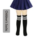 Girls black over-the-knee cotton socks featuring three white stripes athletic style - One Size (7-12 Years) / Black with White Stripes
