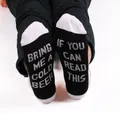 Detailed view of novelty cotton socks featuring funny 'Bring me a cold beer' text on soles - One Size / Beer Theme (COLD BEER) / Black+White