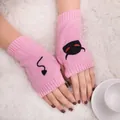 Close-up of pink knitted fingerless gloves with devil face and tail embroidery details - Devil Pattern Fingerless Gloves (ST19 Devil Tail) / Pink