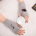 Detail of grey knitted fingerless gloves with Halloween devil embroidery and ribbed cuffs. - Devil Pattern Fingerless Gloves (ST19 Devil Tail) / Light Gray