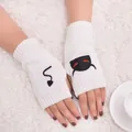 Close-up of white knitted fingerless gloves with devil embroidery motifs. - Devil Pattern Fingerless Gloves (ST19 Devil Tail) / White