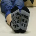 Close-up of funny beer-themed text on the sole of grey and black cotton crew socks - One Size / Black Dark Gray (Bring Me A Beer)