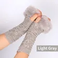 Light gray knitted fingerless gloves featuring butterfly patterns and faux fur trim cuffs - One Size / Light Gray