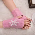 Cozy pink knitted fingerless gloves featuring a white snowflake embroidery detail. - One Size / Pink