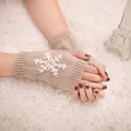 Warm khaki knitted fingerless gloves featuring a stylish white snowflake embroidery detail - One Size / Deep Beige