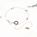 Detailed view of bohemian braided waist chain with wooden ring and shell accents - Brown Buckle / Style 01