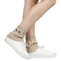 Warm cable knit owl leg warmers for women worn over white sneakers for winter fashion - One Size / Beige