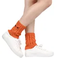 Detailed view of cozy orange knitted owl leg warmers featuring cute decorative eyes - One Size / Pumpkin Orange