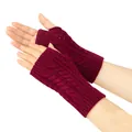 Close-up of burgundy cable knit fingerless gloves showing intricate openwork details. - One Size / Burgundy