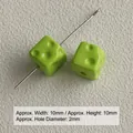 Macro detail showing 10mm green acrylic cheese cube beads for DIY jewelry making - Green