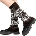 Detail of knitted winter leg warmers featuring a white snowflake pattern on brown - One Size / Coffee