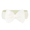 Close-up detail of a cream-colored elastic waist belt with a large decorative chiffon bow. - Off White
