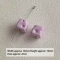 Macro view of lavender acrylic cheese cube beads for DIY crafts, 10mm with 2mm hole - Light Purple