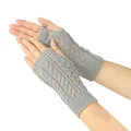 Detailed close-up of grey cable-knit fingerless gloves with openwork pattern on hands - One Size / Light Gray