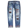 Dettaglio jeans denim strappati da donna con inserti leopardati e paillettes brillanti - Taglia S / Pantaloni e gonne / Floreale Viola