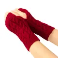 Close-up detail of red cable knit fingerless gloves showing intricate woven texture - One Size / Burgundy