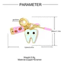 Ciondolo a forma di dente in smalto con tubetto di dentifricio e spazzolino rosa. - Set Dente Spazzolino da Denti Dentifricio (VK238)