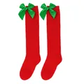 Detailed view of red Christmas knee-high socks with green satin bows for girls - Kids (7-12 Years) / Solid Red with Green Bow